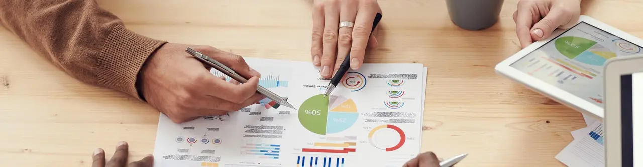 Insurance professionals collaborating on long-term care policy strategies in a modern office